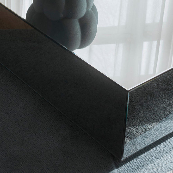 Natural lighting, close up perspective view of a mirror table's reflective details