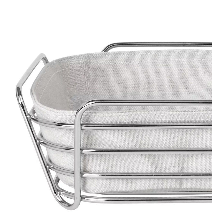 A grill-shaped bread basket with its matching cloth at the center.