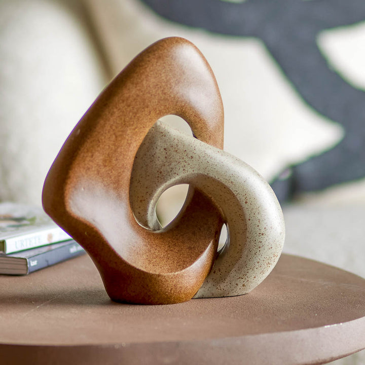 The packshot of Esad Deco brown sculpture on a display table.