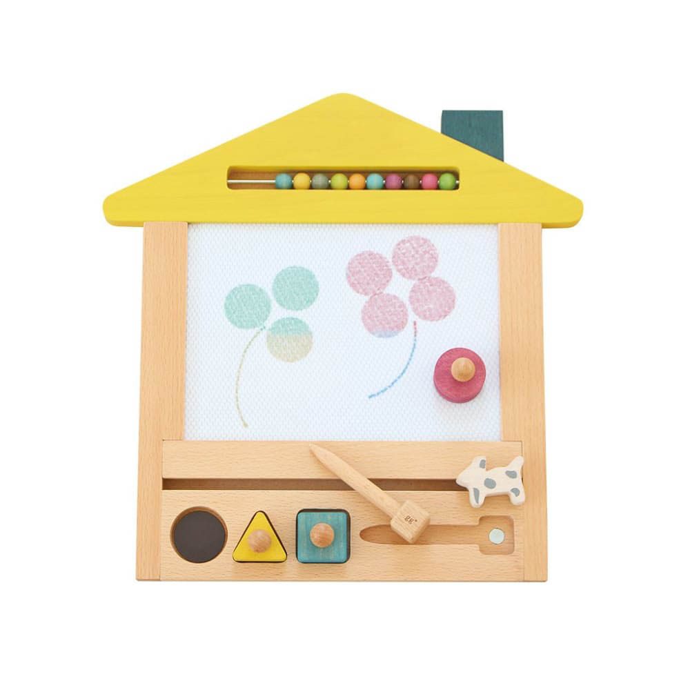 A house shaped wooden drawing board with magnetic stamps made from FSC certified beech wood.