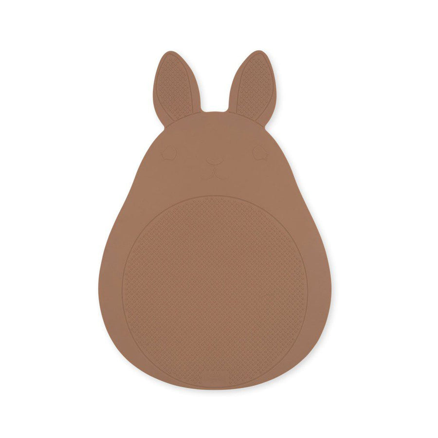 Top view, studio lighting shot of a bunny-shaped rubber bath mat.