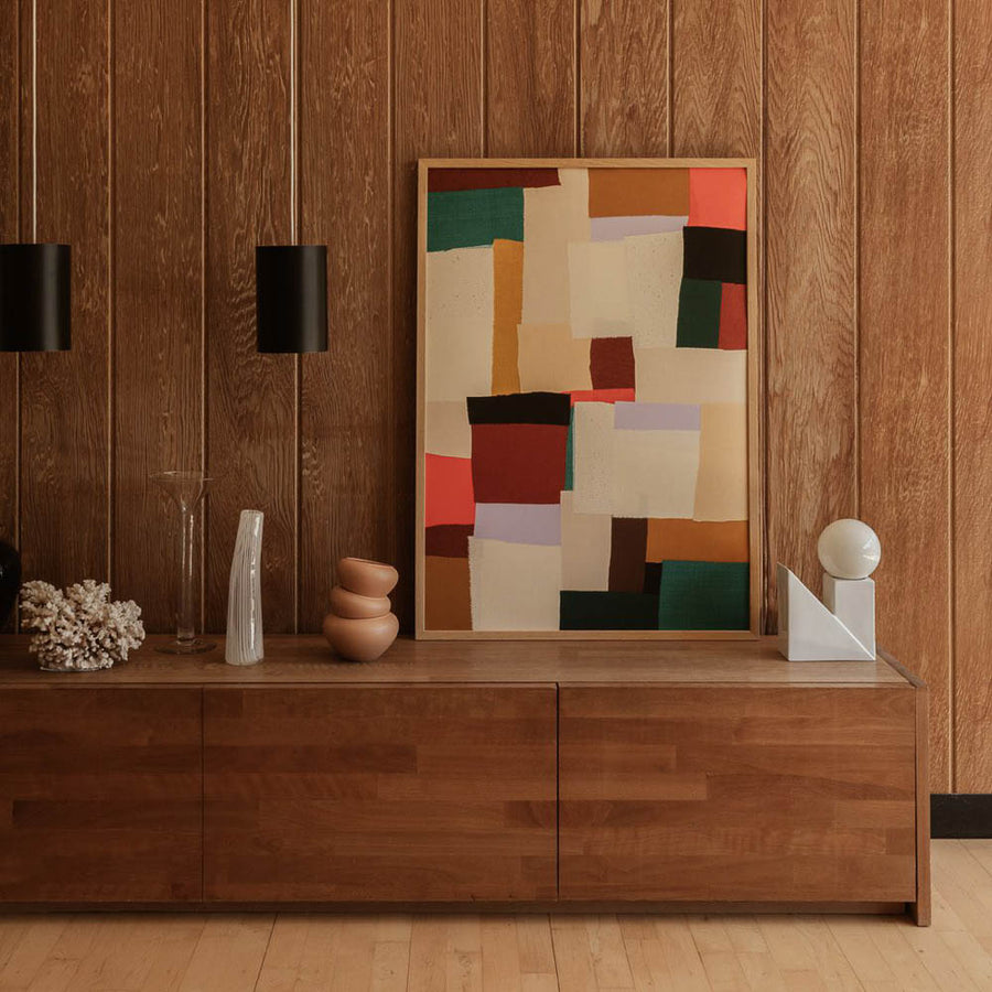 Natural lighting, perspective view of an abstract art print hung on a wall.