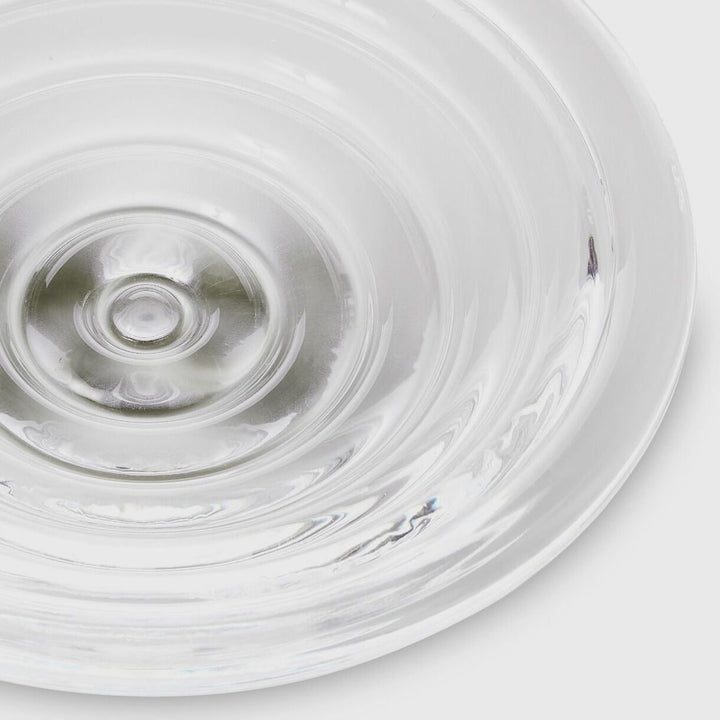 A detailed packshot of Press medium glass bowl by Tom Dixon.