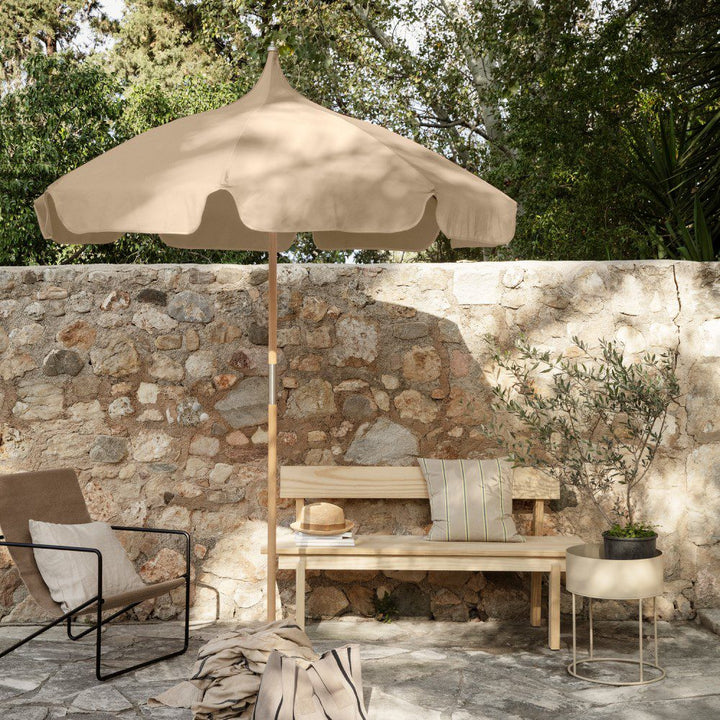 Lull Umbrella by ferm LIVING in warm outdoor setting