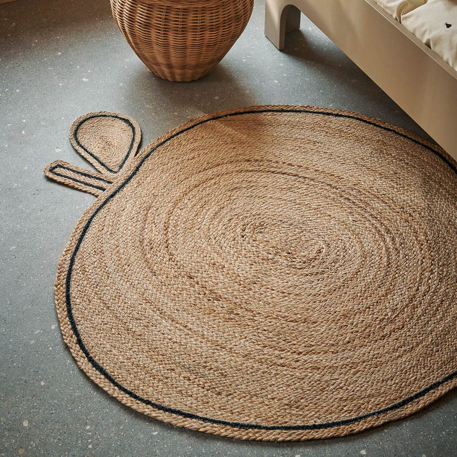 Hand-braided apple jute rug for kids room by ferm Living.